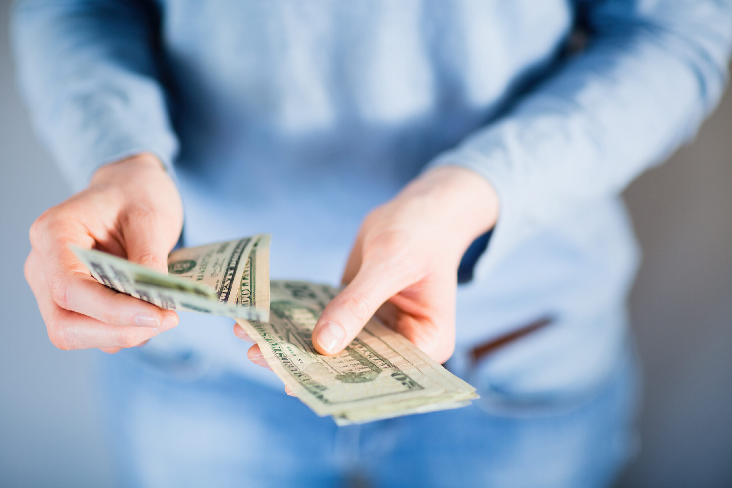 person-holding-cash